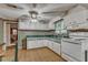 Kitchen features white cabinets and green countertops at 9336 Baileywick Rd, Raleigh, NC 27615