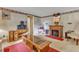 Living room with fireplace and vintage furniture at 9336 Baileywick Rd, Raleigh, NC 27615