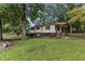 House exterior showcasing a large yard and trees at 9336 Baileywick Rd, Raleigh, NC 27615