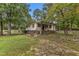 Ranch home showcasing a side view of the home and landscaping at 9336 Baileywick Rd, Raleigh, NC 27615