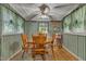 Bright dining area with wood table and chairs, featuring striped wallpaper at 9336 Baileywick Rd, Raleigh, NC 27615