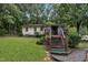 House exterior with wooden steps and deck at 9336 Baileywick Rd, Raleigh, NC 27615