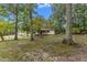 Ranch home surrounded by lush trees and landscaping at 9336 Baileywick Rd, Raleigh, NC 27615