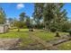 Large backyard with a shed and pathways at 9336 Baileywick Rd, Raleigh, NC 27615