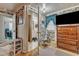 Bedroom with large dresser and view into bathroom at 9336 Baileywick Rd, Raleigh, NC 27615