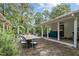 Large patio with dining area and string lights, near a house at 1021 Dimmocks Mill Rd, Hillsborough, NC 27278