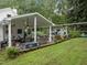 Outdoor patio with seating area and grill, perfect for entertaining at 1021 Dimmocks Mill Rd, Hillsborough, NC 27278