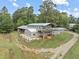 Two-story home with a large deck and surrounding land at 1021 Dimmocks Mill Rd, Hillsborough, NC 27278