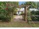 Inviting walkway to charming home with pergola and rose bushes at 1021 Dimmocks Mill Rd, Hillsborough, NC 27278