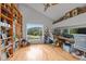 Home office with built-in shelves, hardwood floors, and scenic views at 1021 Dimmocks Mill Rd, Hillsborough, NC 27278