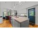 Large kitchen island with sink and seating area at 1021 Dimmocks Mill Rd, Hillsborough, NC 27278