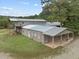Property showcasing a barn and large home with a deck at 1021 Dimmocks Mill Rd, Hillsborough, NC 27278