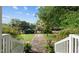 Stone pathway leads to a private backyard at 1021 Dimmocks Mill Rd, Hillsborough, NC 27278