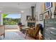 Main bedroom sitting area with fireplace and views of nature at 1021 Dimmocks Mill Rd, Hillsborough, NC 27278