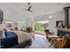 Main bedroom with fireplace, sitting area, and large window with a view at 1021 Dimmocks Mill Rd, Hillsborough, NC 27278