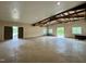 Spacious open area with concrete floors, high ceilings, and barn doors at 1021 Dimmocks Mill Rd, Hillsborough, NC 27278