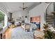 Bright main bedroom with sitting area, fireplace, and hardwood floors at 1021 Dimmocks Mill Rd, Hillsborough, NC 27278
