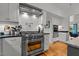 Modern kitchen with stainless steel appliances and white shaker cabinets at 1021 Dimmocks Mill Rd, Hillsborough, NC 27278