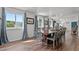 Bright dining room with hardwood floors and view to kitchen at 1021 Dimmocks Mill Rd, Hillsborough, NC 27278