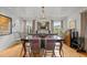 Spacious dining area with hardwood floors and chandelier at 1021 Dimmocks Mill Rd, Hillsborough, NC 27278