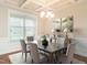 Bright dining room with a chandelier and hardwood floors at 1207 Brookview Dr, Elon, NC 27244