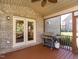 Brick detail screened porch with access to the backyard at 1207 Brookview Dr, Elon, NC 27244