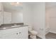 Clean bathroom with white vanity, gray countertop, and a shower/tub combo at 275 Trescott St, Smithfield, NC 27577