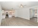 Open living room with kitchen island and vinyl flooring at 275 Trescott St, Smithfield, NC 27577