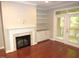 Living room with hardwood floors, fireplace, and built-ins at 7250 Nc 751 Hwy # 2101, Durham, NC 27707