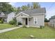 House exterior with a front porch and walkway at 204 W Hill St, Benson, NC 27504