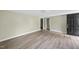 Spacious living room with wood-look floors and a door at 204 W Hill St, Benson, NC 27504