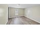 Cozy bedroom with a window and wood-look floors at 204 W Hill St, Benson, NC 27504