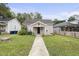 Quaint house exterior with a well-maintained lawn at 204 W Hill St, Benson, NC 27504