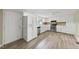 Clean kitchen featuring white cabinets and stainless steel appliances at 204 W Hill St, Benson, NC 27504