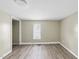 Well-lit bedroom with window and closet at 204 W Hill St, Benson, NC 27504