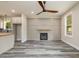 Living room with fireplace and wood-look flooring at 705 Jefferson St, Henderson, NC 27536