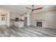 Open concept kitchen with island and gas fireplace at 705 Jefferson St, Henderson, NC 27536