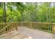 Wooden deck overlooking a wooded area at 705 Jefferson St, Henderson, NC 27536