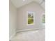 Bright bedroom with vaulted ceilings and carpeting at 705 Jefferson St, Henderson, NC 27536