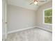 Bright bedroom with neutral walls and carpet at 705 Jefferson St, Henderson, NC 27536