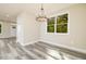 Bright dining room with large windows and a chandelier at 705 Jefferson St, Henderson, NC 27536