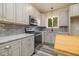 Modern kitchen features stainless steel appliances and granite countertops at 705 Jefferson St, Henderson, NC 27536