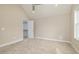 Spacious bedroom with carpeted floor and large closet at 705 Jefferson St, Henderson, NC 27536