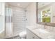 Modern bathroom with shower, vanity, and tiled walls at 705 Jefferson St, Henderson, NC 27536