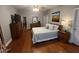 Main bedroom with king-size bed and access to private deck at 1150 Old County Home Rd, Nashville, NC 27856