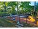 Brick patio garden with raised planting beds and a metal frame at 532 Lena Cir, Chapel Hill, NC 27516