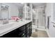 Bathroom with double vanity, shower, and shelving at 532 Lena Cir, Chapel Hill, NC 27516