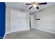 Bedroom with double closet doors and ceiling fan, featuring neutral walls at 532 Lena Cir, Chapel Hill, NC 27516