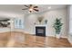 Living room with hardwood floors, fireplace, and large windows at 532 Lena Cir, Chapel Hill, NC 27516