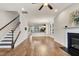 Open living room with hardwood floors, fireplace, and access to kitchen at 532 Lena Cir, Chapel Hill, NC 27516